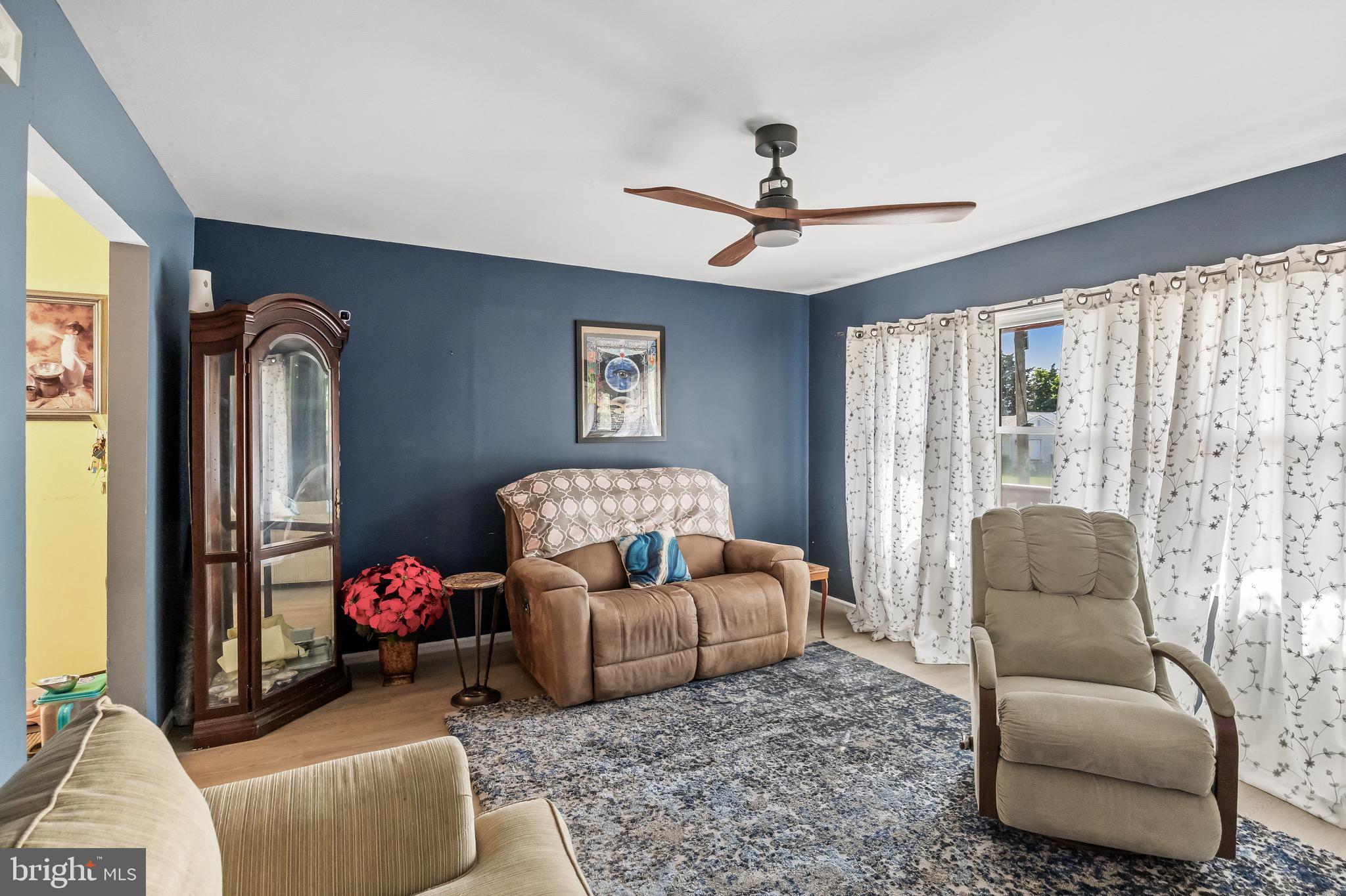 109 North Ambler Road Somers Point, NJ 08244 - Photo 10 of 22 a living room with furniture and a large window