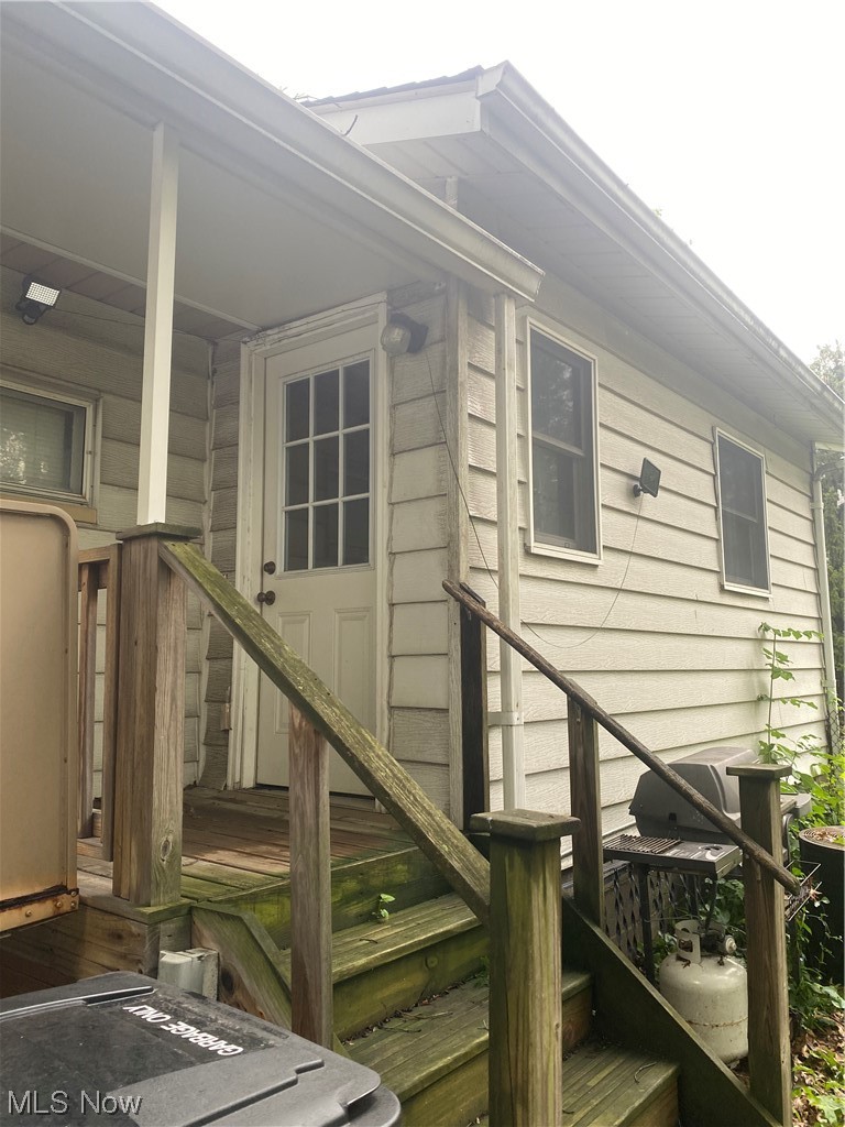 Doorway to property with wooden deck