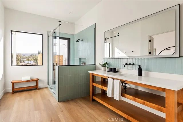 a view of kitchen with stainless steel appliances cabinets and wooden floor