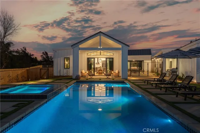 a view of swimming pool with outdoor seating