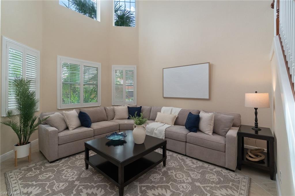 19753 Tesoro Way Estero, FL 33967 - Photo 7 of 47 a living room with furniture and a large window