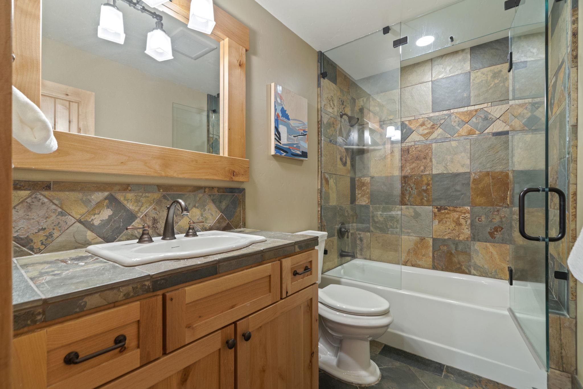 735 Cascade Circle Homewood, CA 96141 - Photo 21 of 21 a bathroom with a sink a toilet and shower