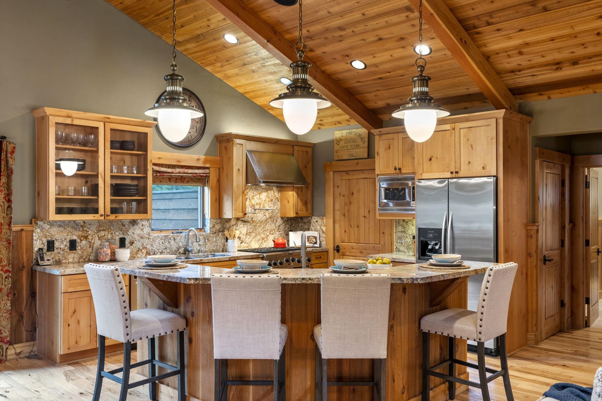 735 Cascade Circle Homewood, CA 96141 - Photo 7 of 21 a kitchen with a table and chairs