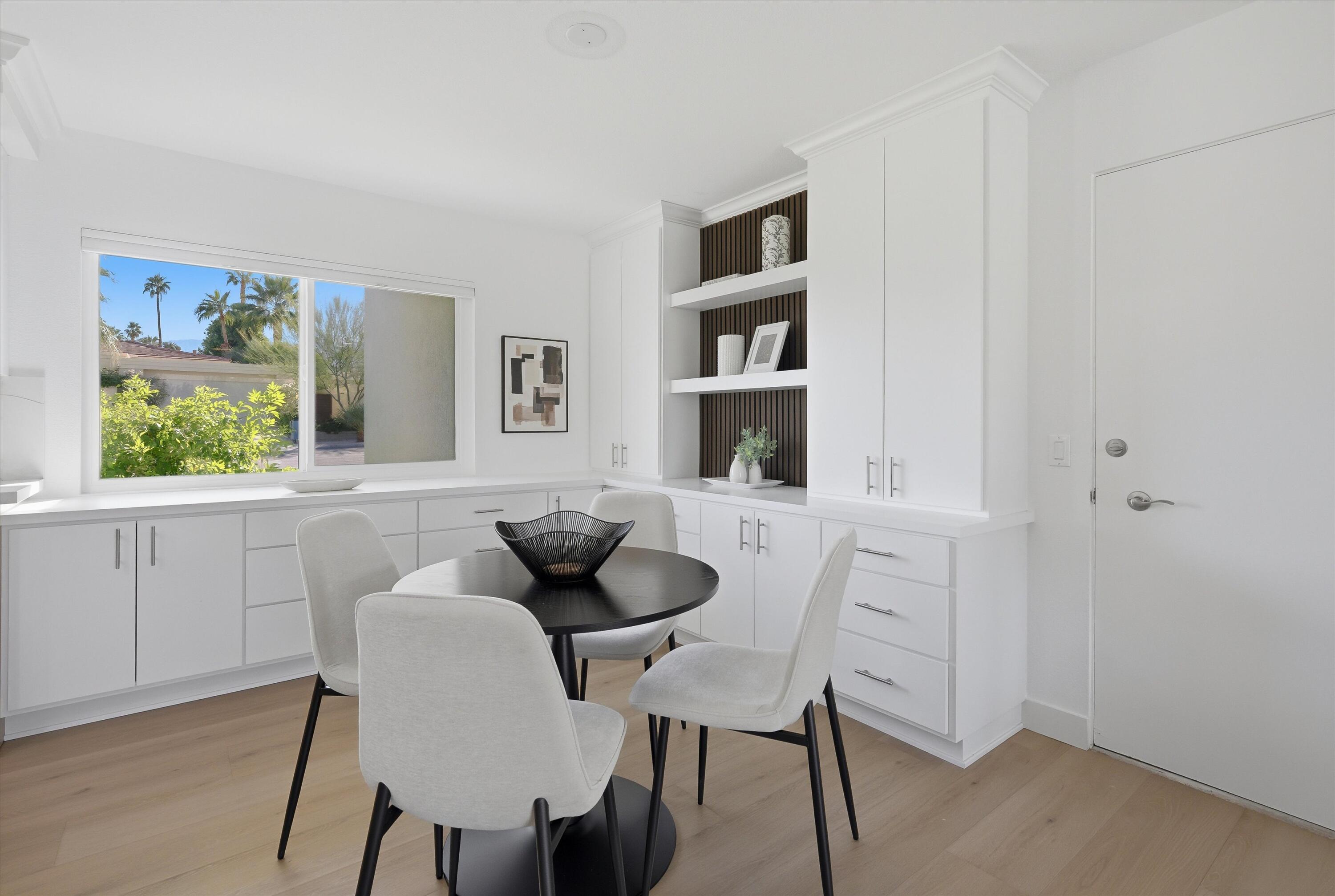 72920 Somera Road Palm Desert, CA 92260 - Photo 11 of 49 a dining room with furniture and window