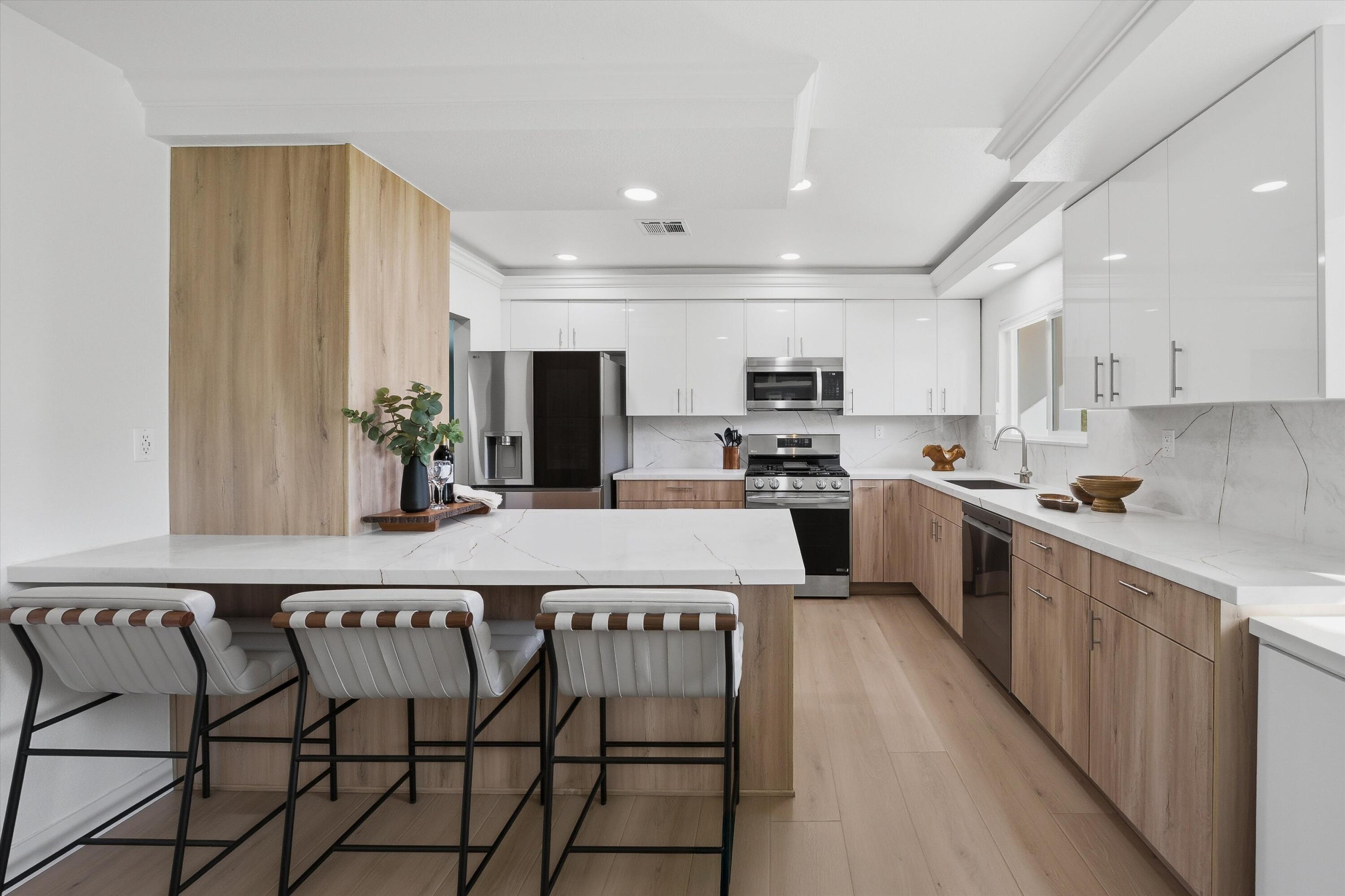 72920 Somera Road Palm Desert, CA 92260 - Photo 12 of 49 a kitchen with kitchen island granite countertop lots of counter top space and cabinets