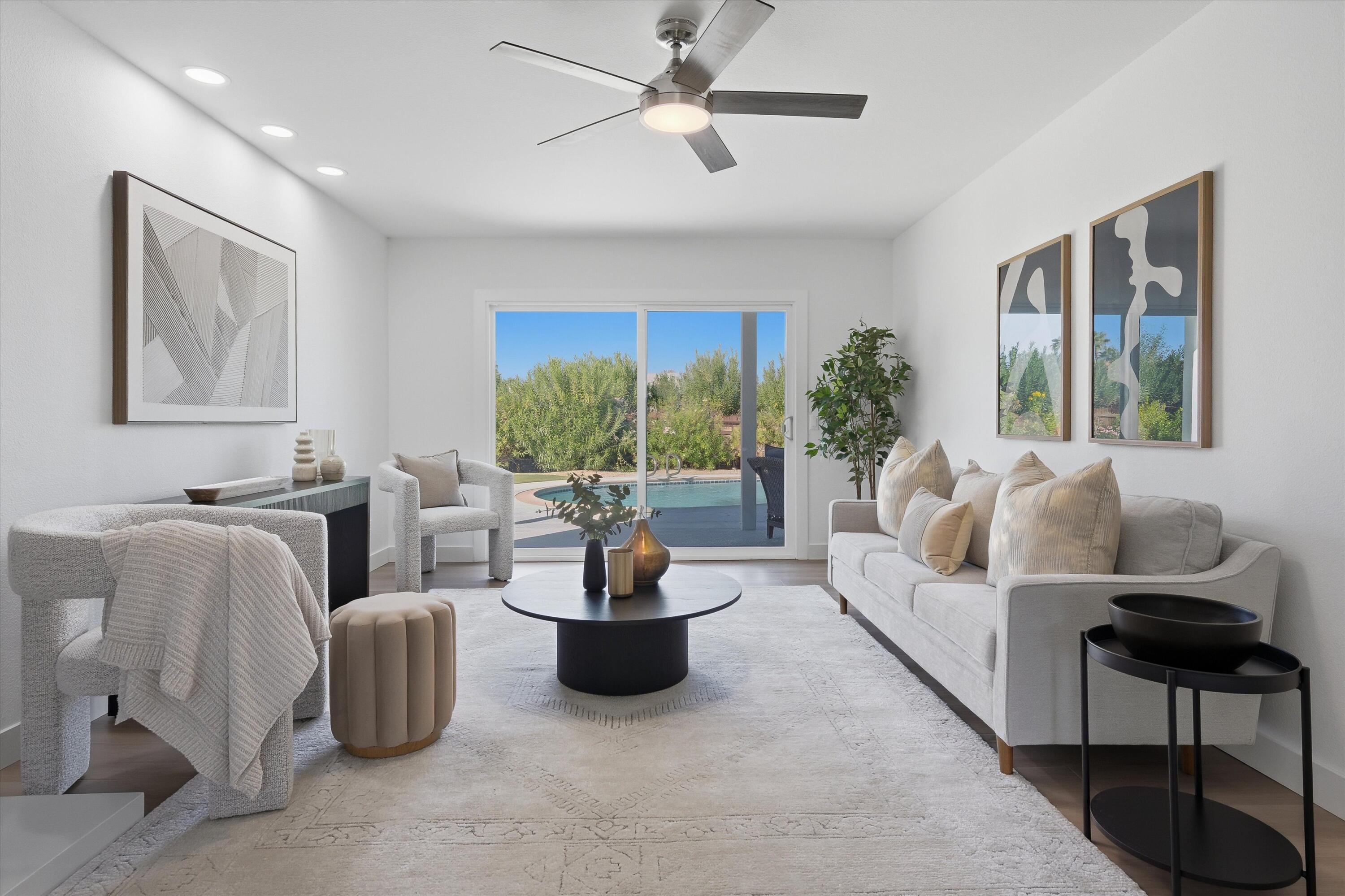 72920 Somera Road Palm Desert, CA 92260 - Photo 16 of 49 a living room with furniture and a potted plant