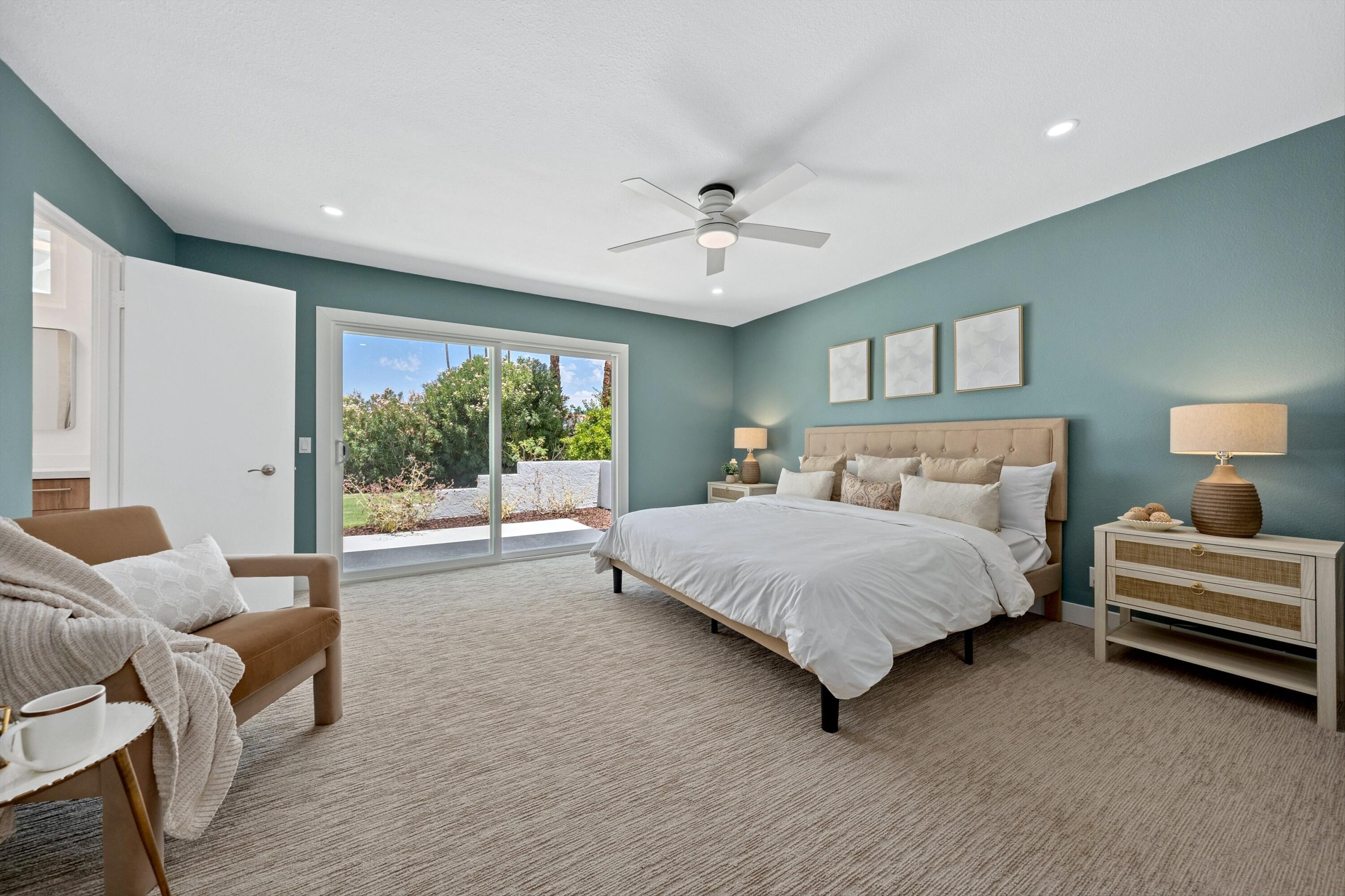 72920 Somera Road Palm Desert, CA 92260 - Photo 25 of 49 a bedroom with bed and balcony