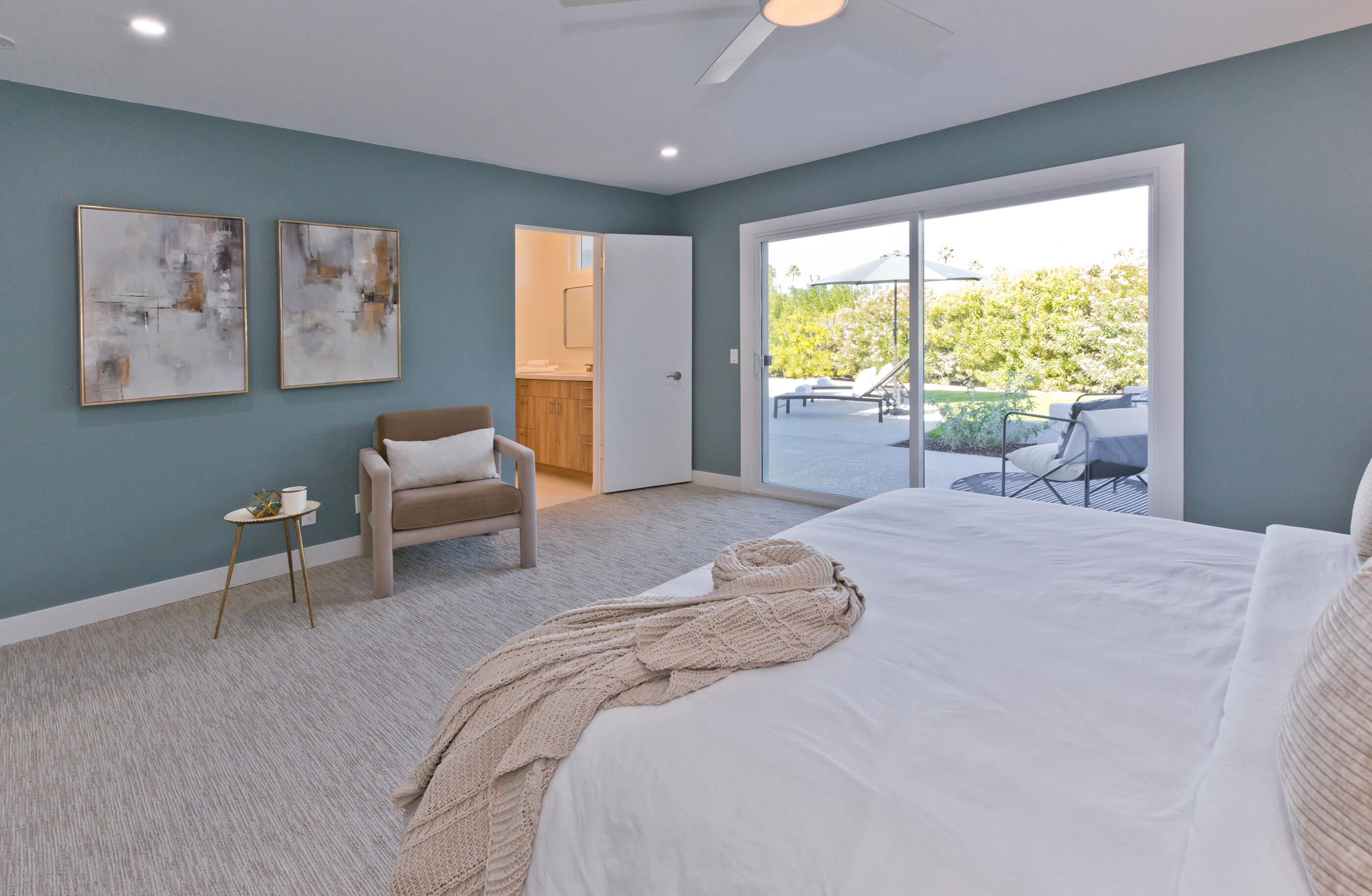 72920 Somera Road Palm Desert, CA 92260 - Photo 26 of 49 a bed room with a bed and a chair