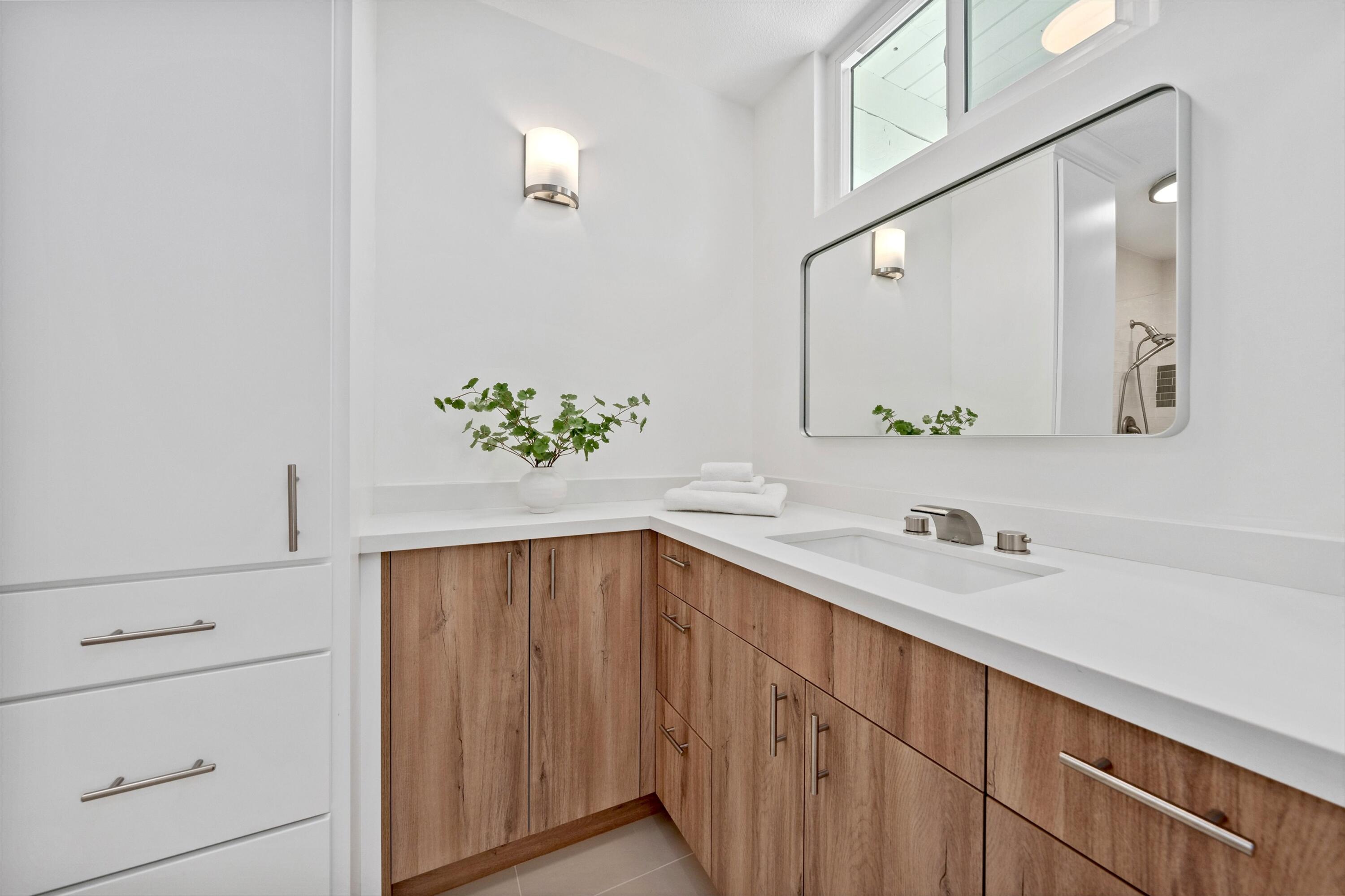 72920 Somera Road Palm Desert, CA 92260 - Photo 27 of 49 a bathroom with a sink and a mirror