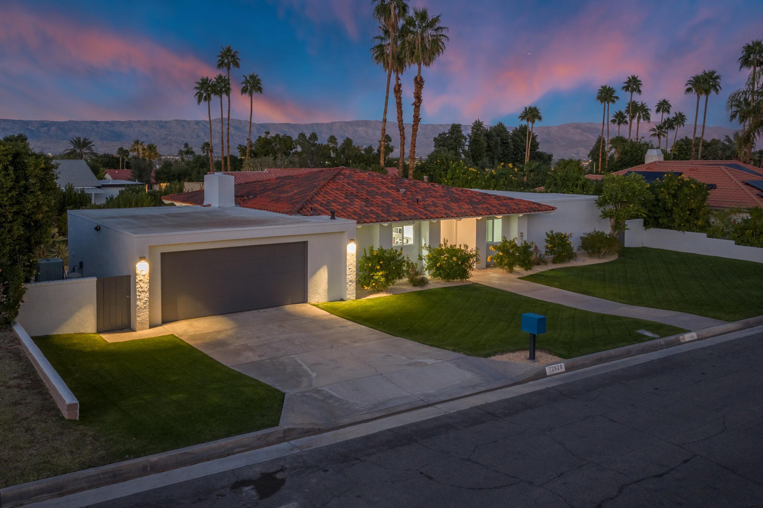 72920 Somera Road Palm Desert, CA 92260 - Photo 31 of 49 a view of a yard and front view of a house