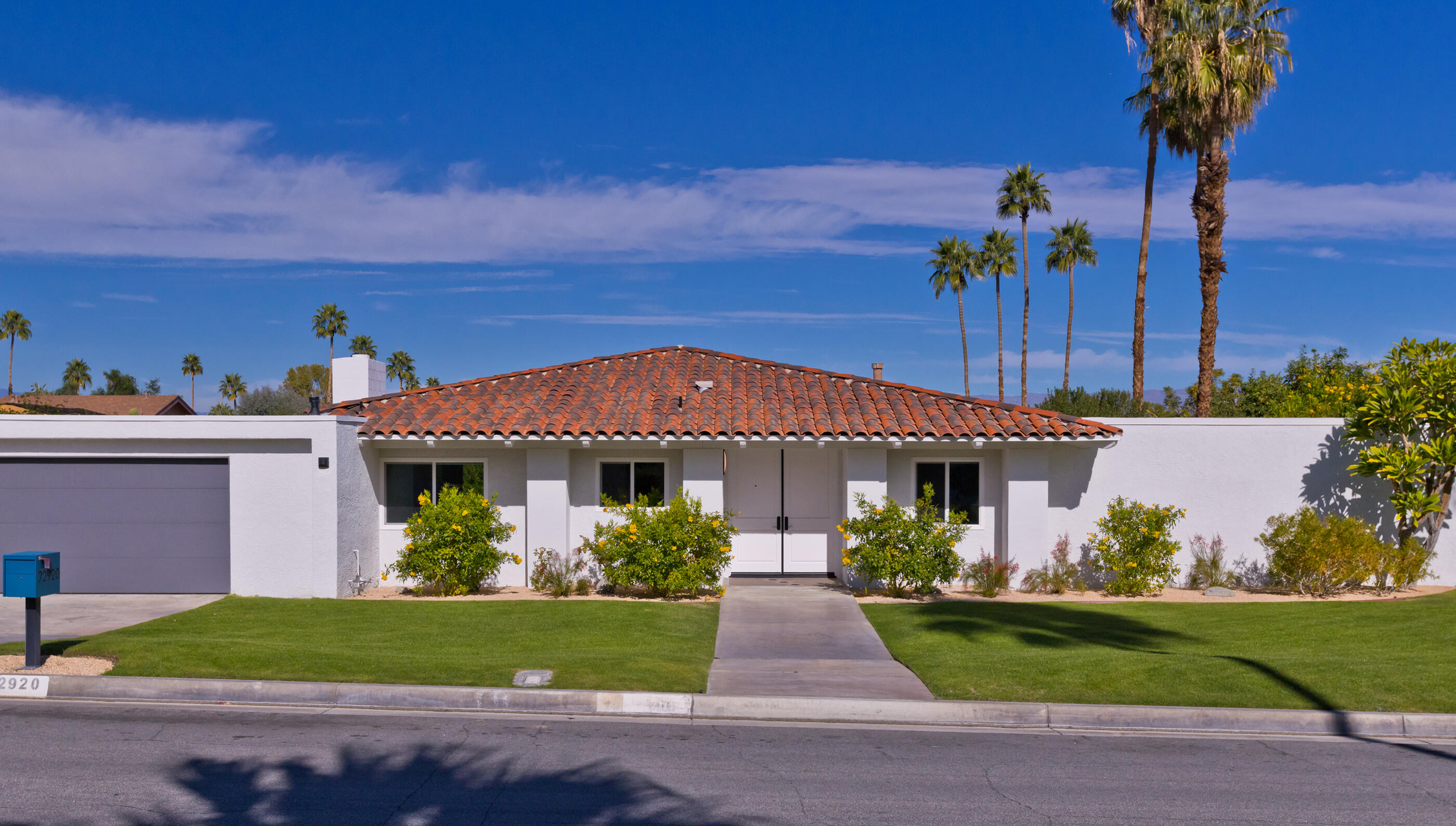 72920 Somera Road Palm Desert, CA 92260 - Photo 33 of 49 a front view of a house with a garden
