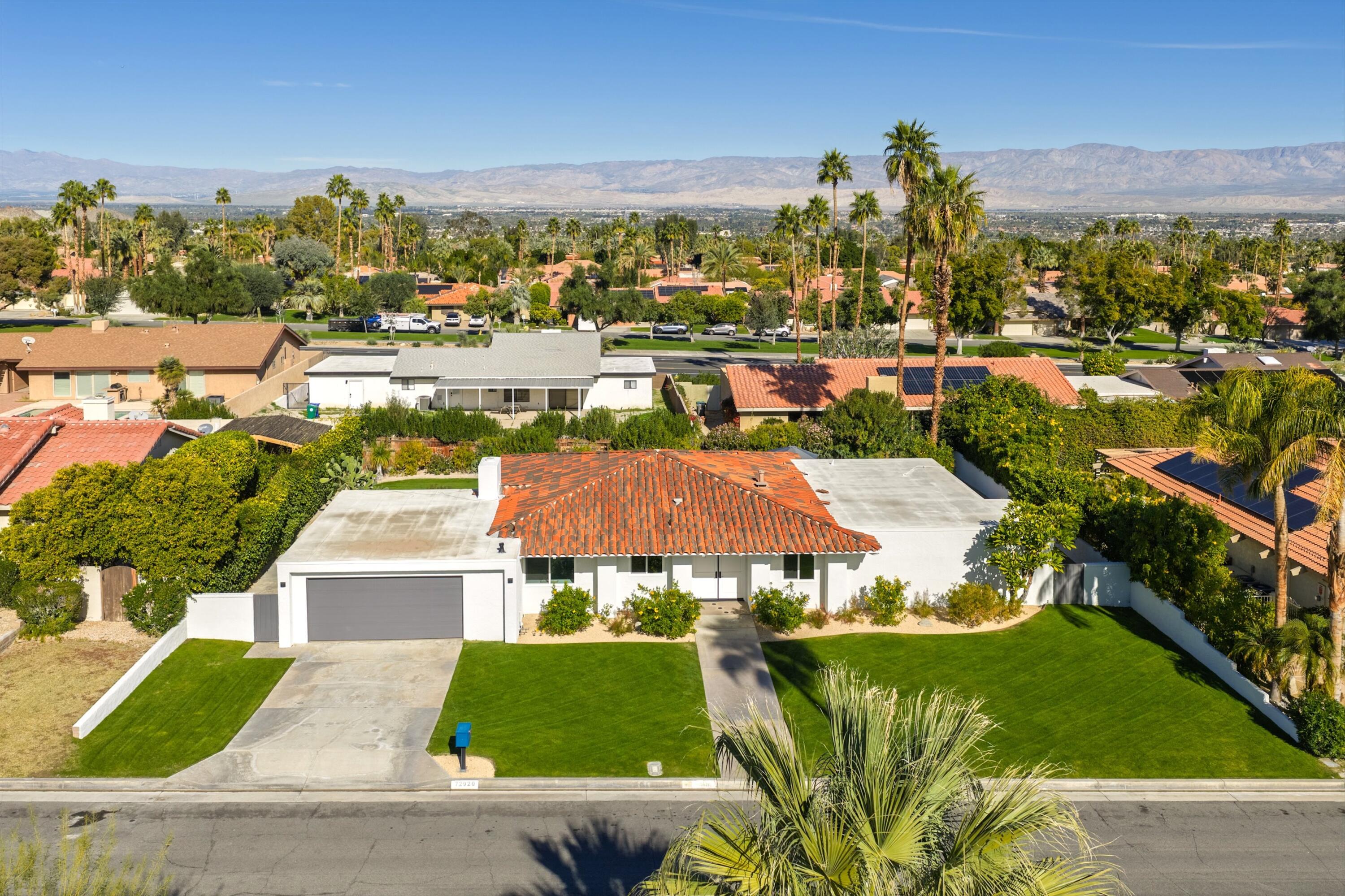 72920 Somera Road Palm Desert, CA 92260 - Photo 34 of 49 an aerial view of residential houses with outdoor space and swimming pool