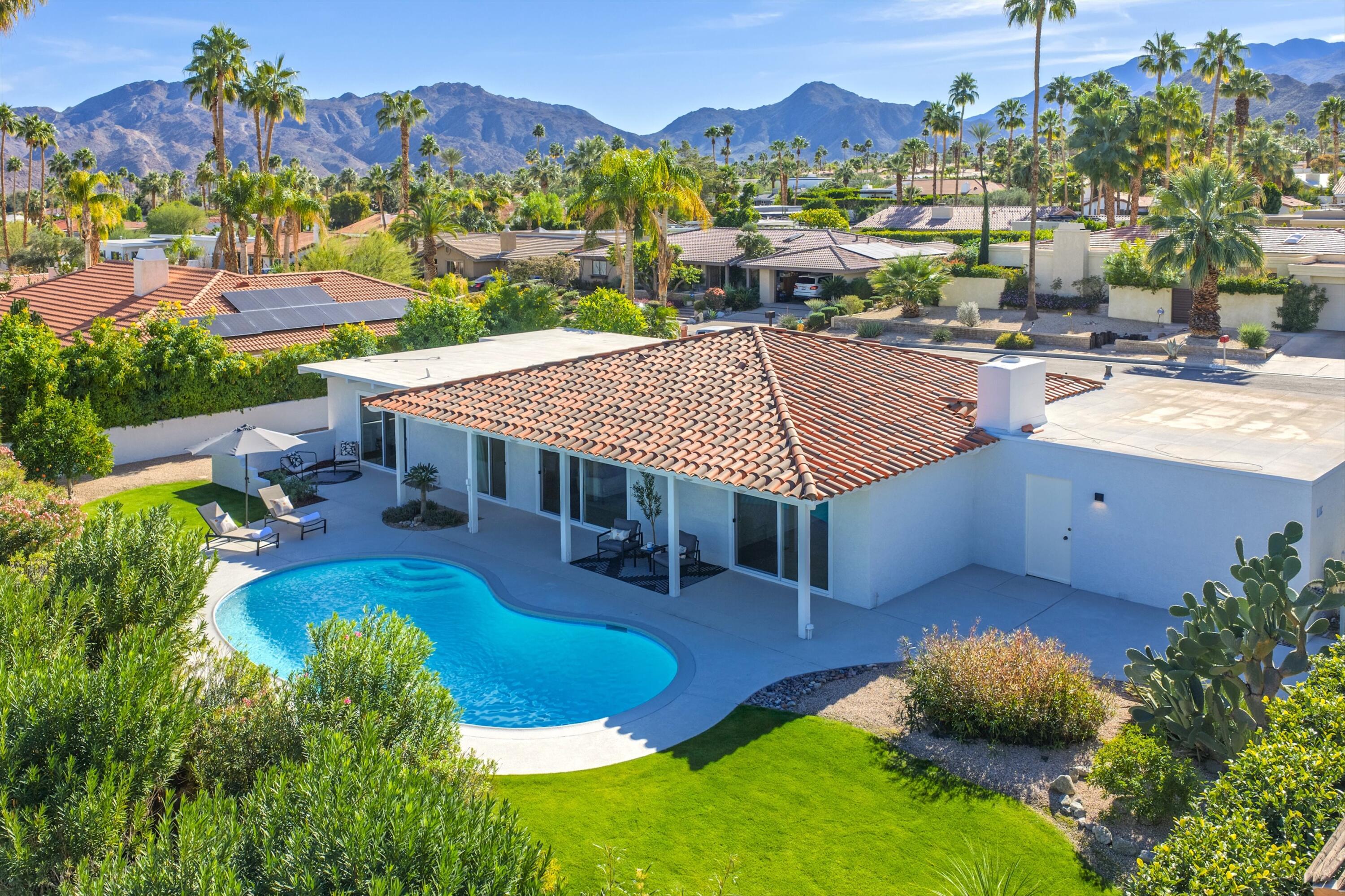 72920 Somera Road Palm Desert, CA 92260 - Photo 37 of 49 an aerial view of a house with swimming pool outdoor seating and yard