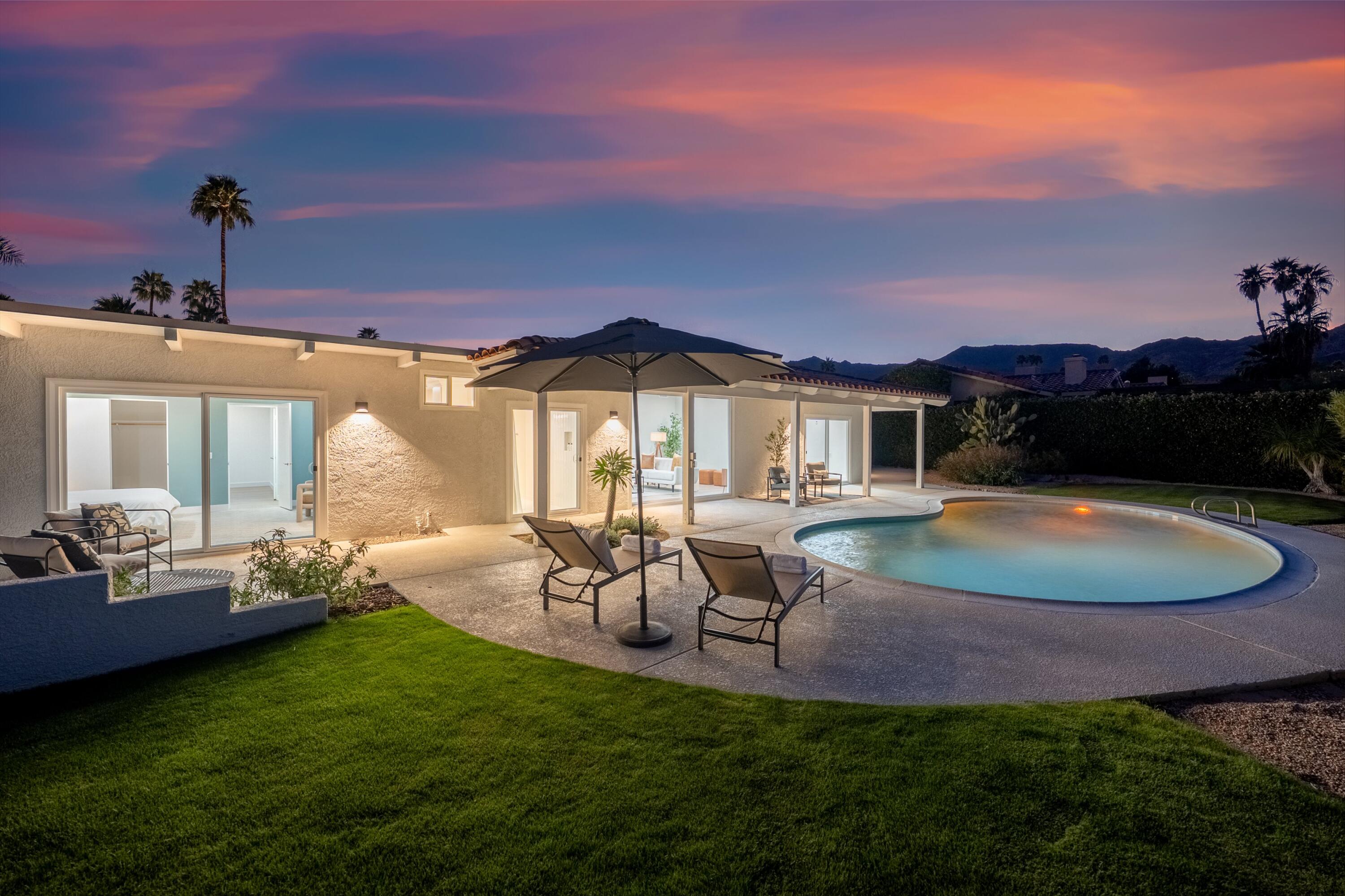 72920 Somera Road Palm Desert, CA 92260 - Photo 4 of 49 a view of a house with backyard porch and patio