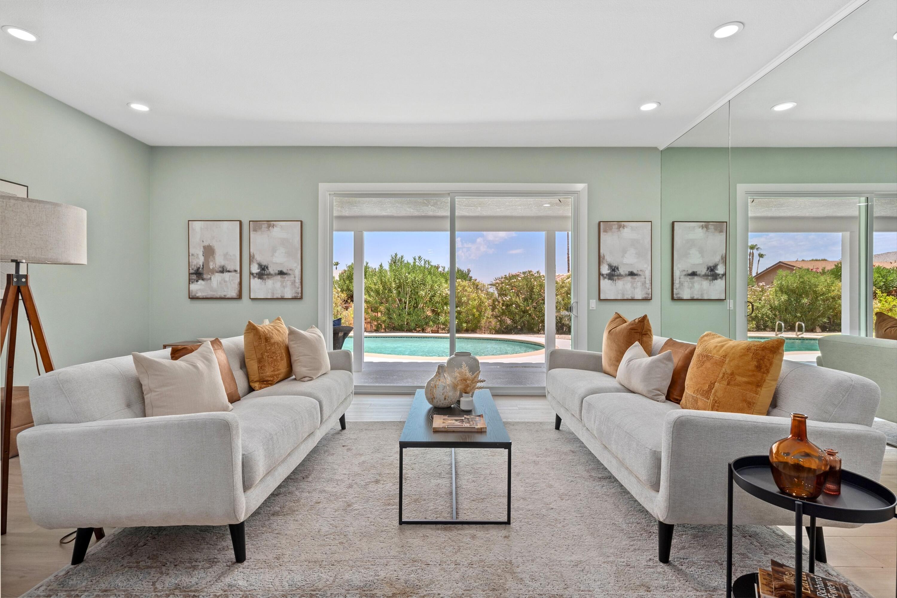 72920 Somera Road Palm Desert, CA 92260 - Photo 8 of 49 a living room with furniture and a large window