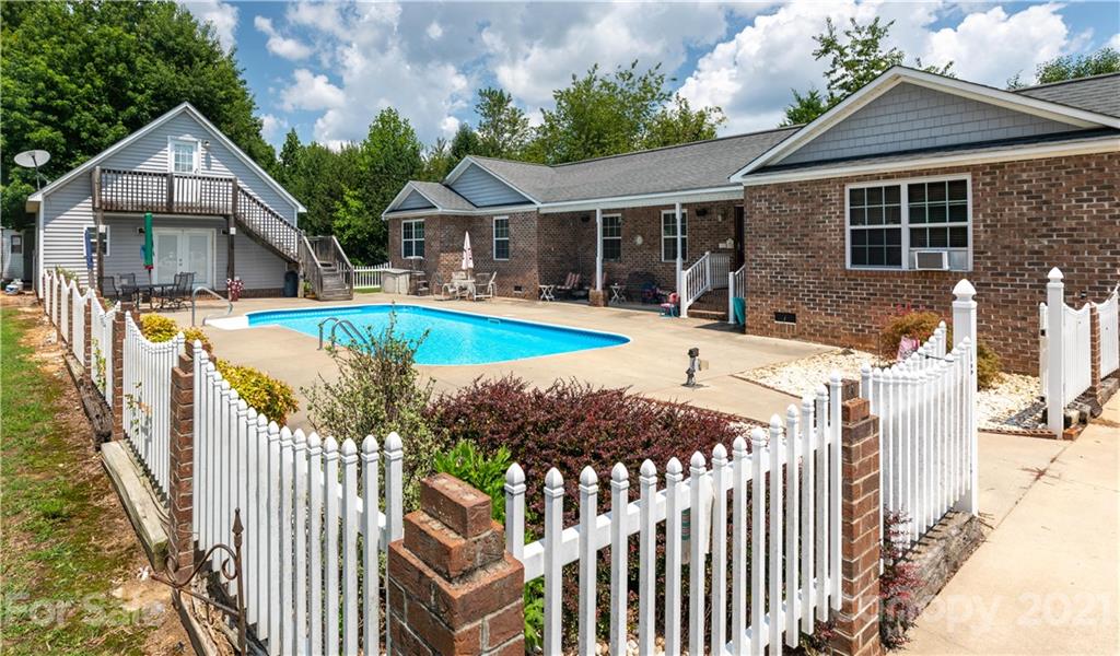 a view of house with outdoor seating yard