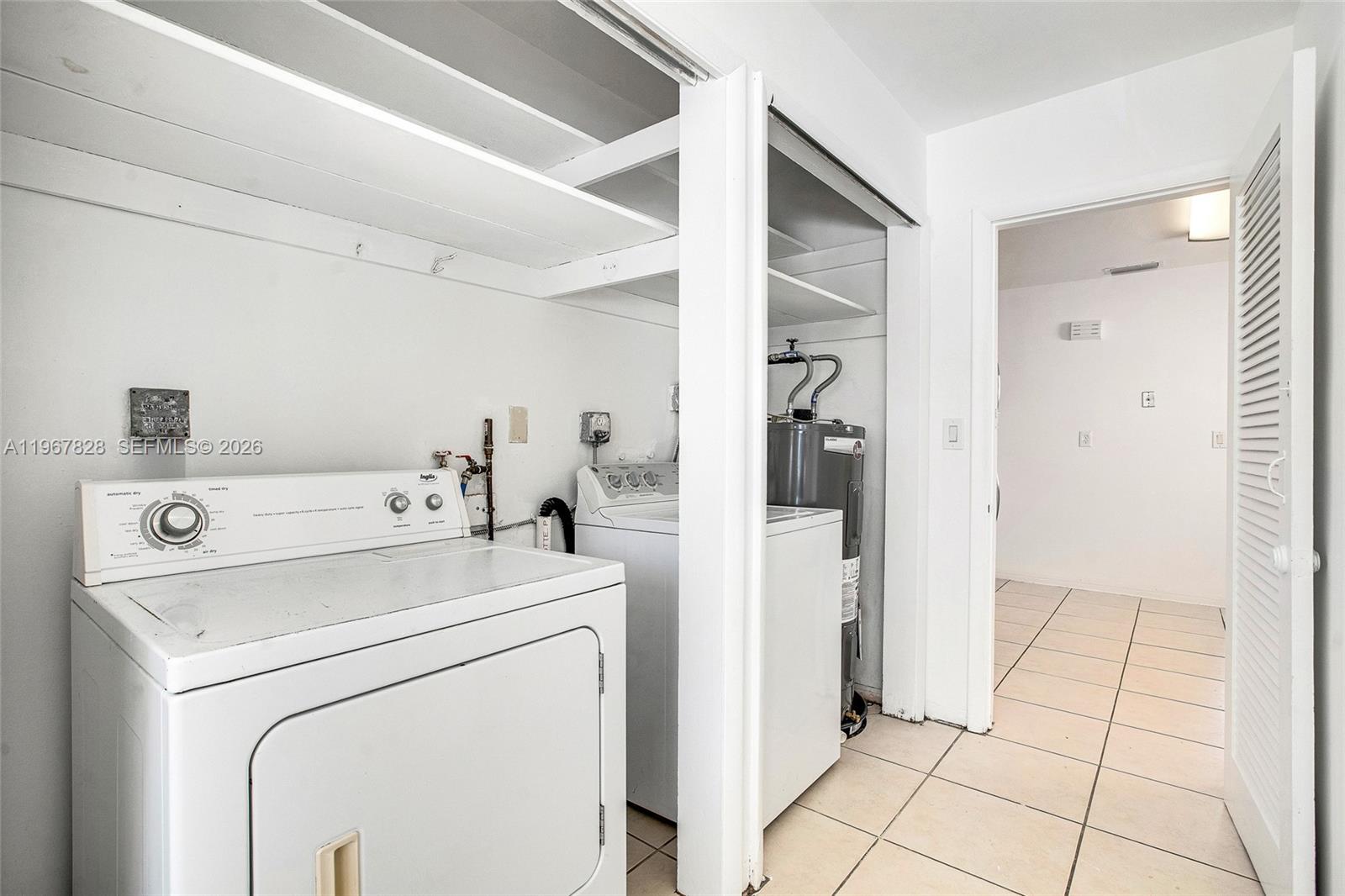 9372 Abbott Avenue Surfside, FL 33154 - Photo 18 of 25 a view of storage and utility room with washer and dryer