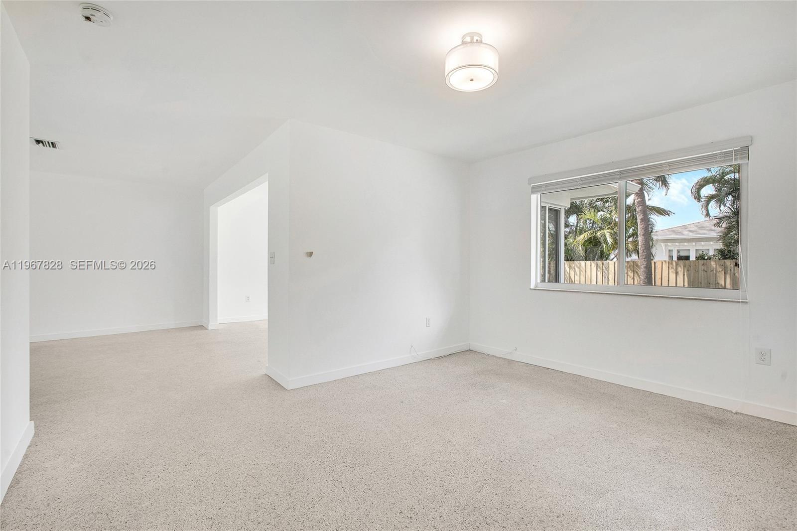 9372 Abbott Avenue Surfside, FL 33154 - Photo 5 of 25 a view of an empty room with a window
