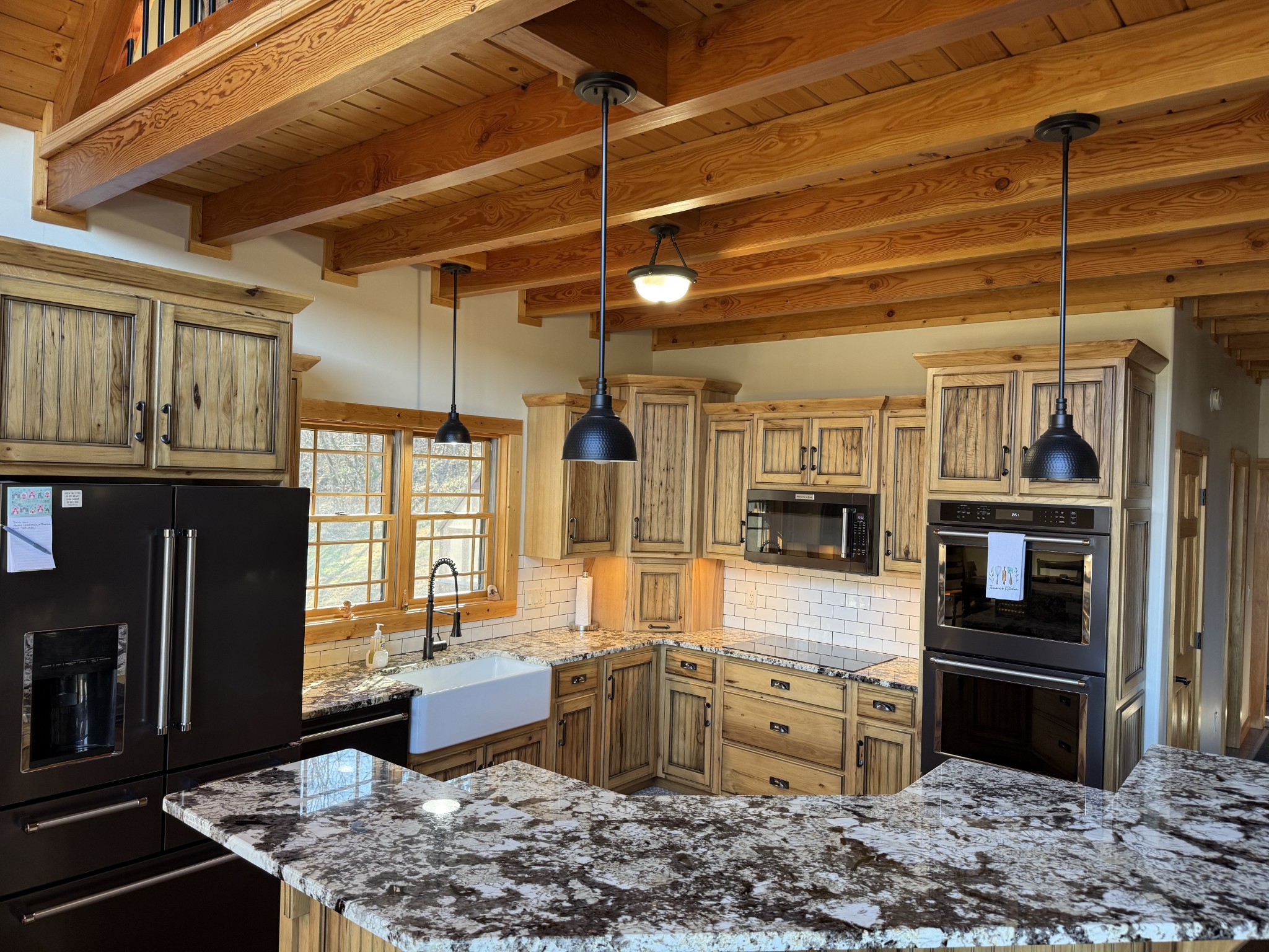 575 East Fork Road Whitleyville, TN 38588 - Photo 2 of 45 a kitchen with stainless steel appliances kitchen island granite countertop a stove refrigerator and cabinets