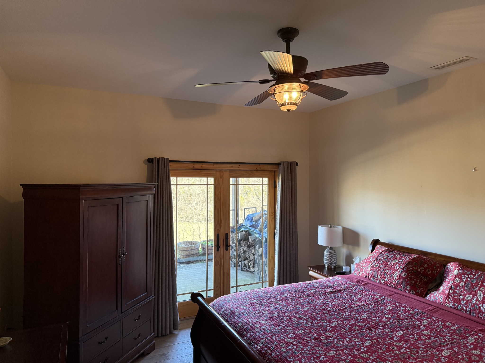 575 East Fork Road Whitleyville, TN 38588 - Photo 36 of 45 a bedroom with a large bed and a chandelier
