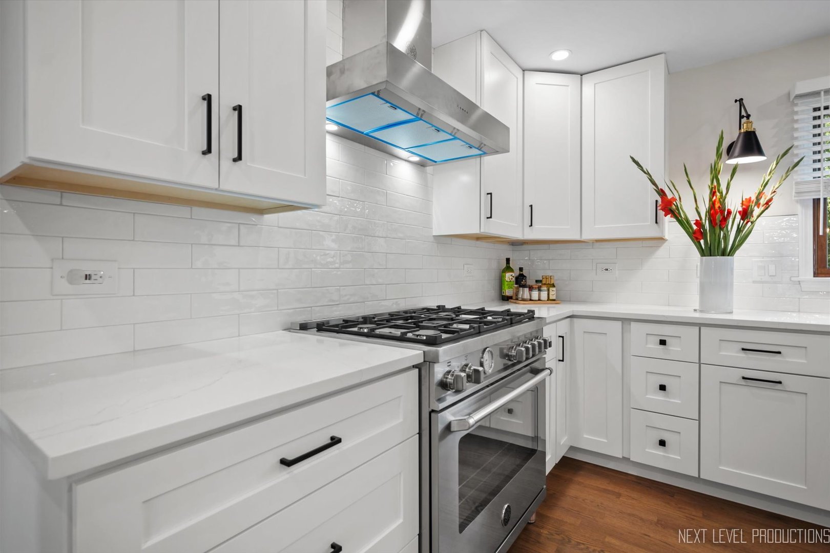 Undisclosed Address Geneva, IL 60134 - Photo 5 of 10 a kitchen with stainless steel appliances white cabinets and a stove