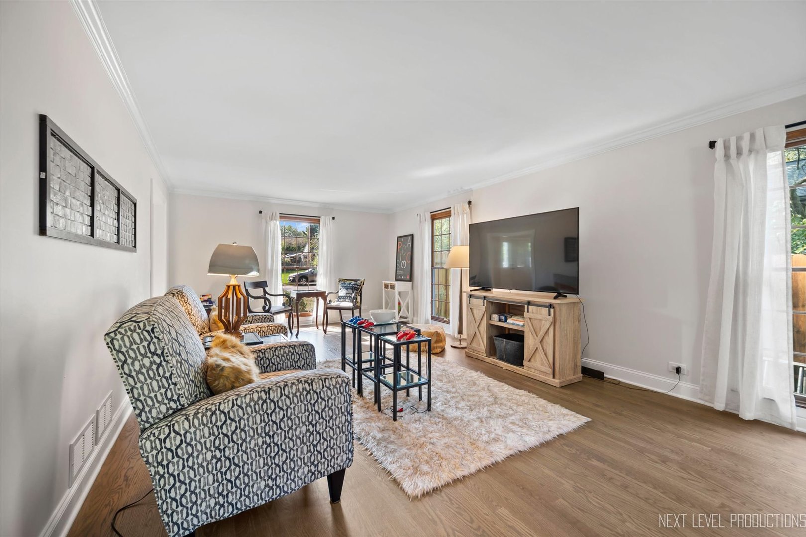 Undisclosed Address Geneva, IL 60134 - Photo 8 of 10 a living room with furniture and a flat screen tv