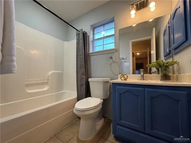 a bathroom with a glass door shower