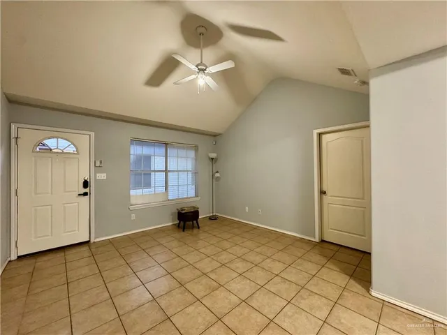 a view of an empty room and window