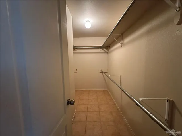 a bathroom with a sink vanity mirror and toilet