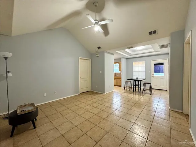 a view of livingroom with furniture and a ceiling fan