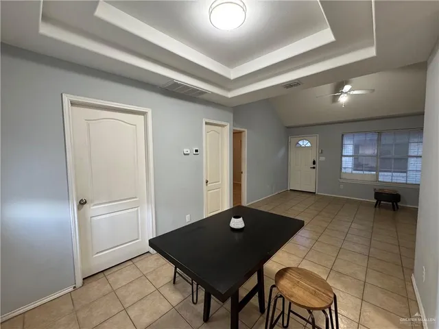 a view of a dining room with furniture and window
