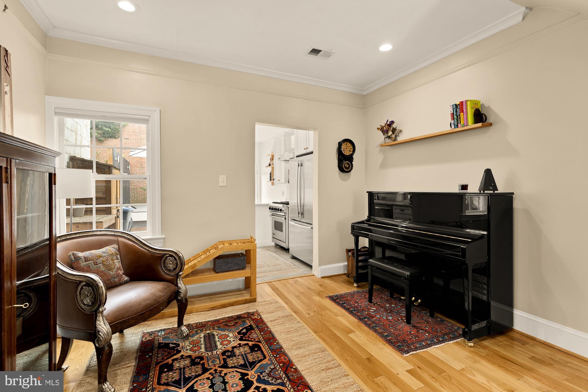 1338 28th Street Northwest Washington, DC 20007 - Photo 12 of 39 a living room with furniture and wooden floor