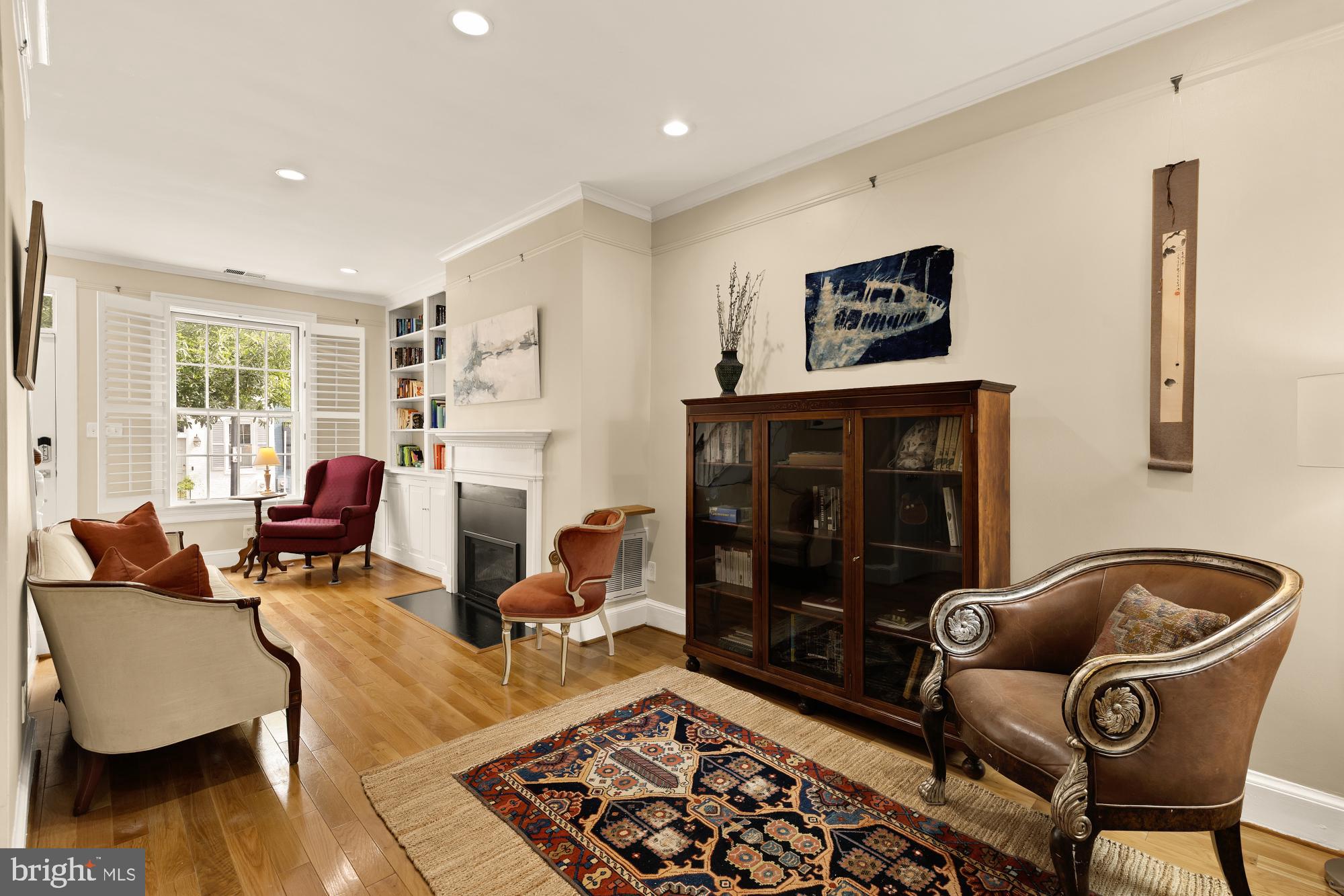 1338 28th Street Northwest Washington, DC 20007 - Photo 8 of 39 a living room with furniture and a fireplace