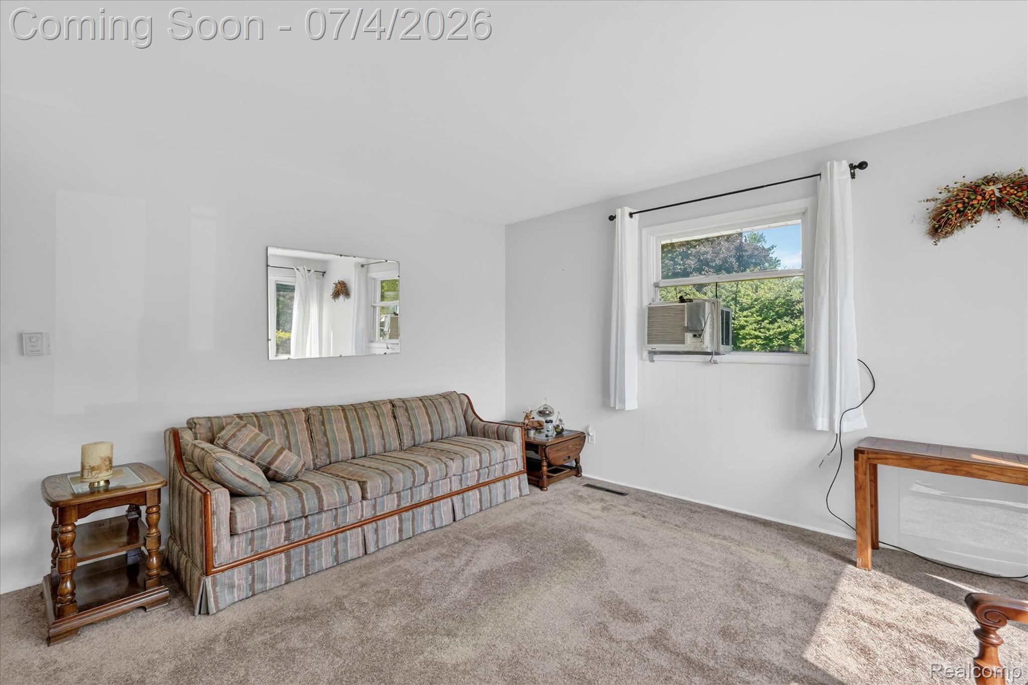 2091 North Irish Road Davison, MI 48423 - Photo 3 of 25 Carpeted room with white walls, featuring a window and a wall-mounted mirror