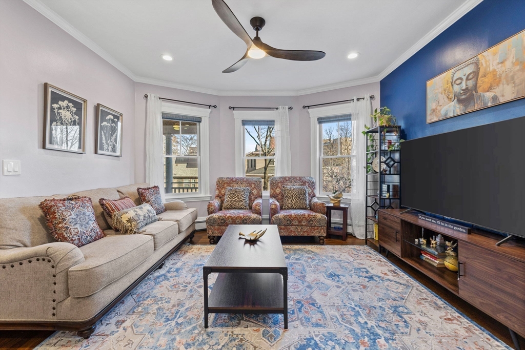 62 Atherton Road, Unit 1 Brookline, MA 02446 - Photo 5 of 24 a living room with furniture and a flat screen tv