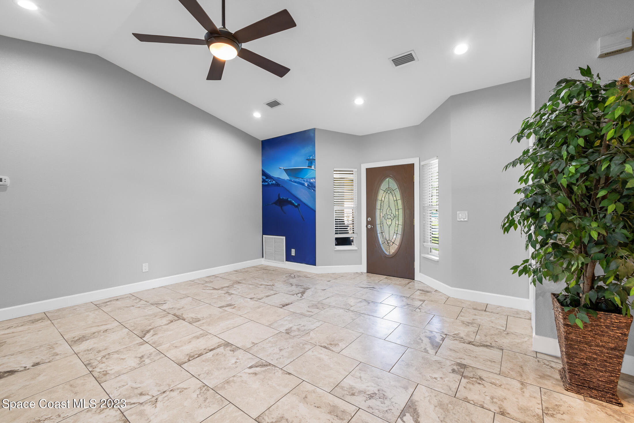 2660 Corey Road Malabar, FL 32950 - Photo 23 of 50 a view of a livingroom with a potted plant