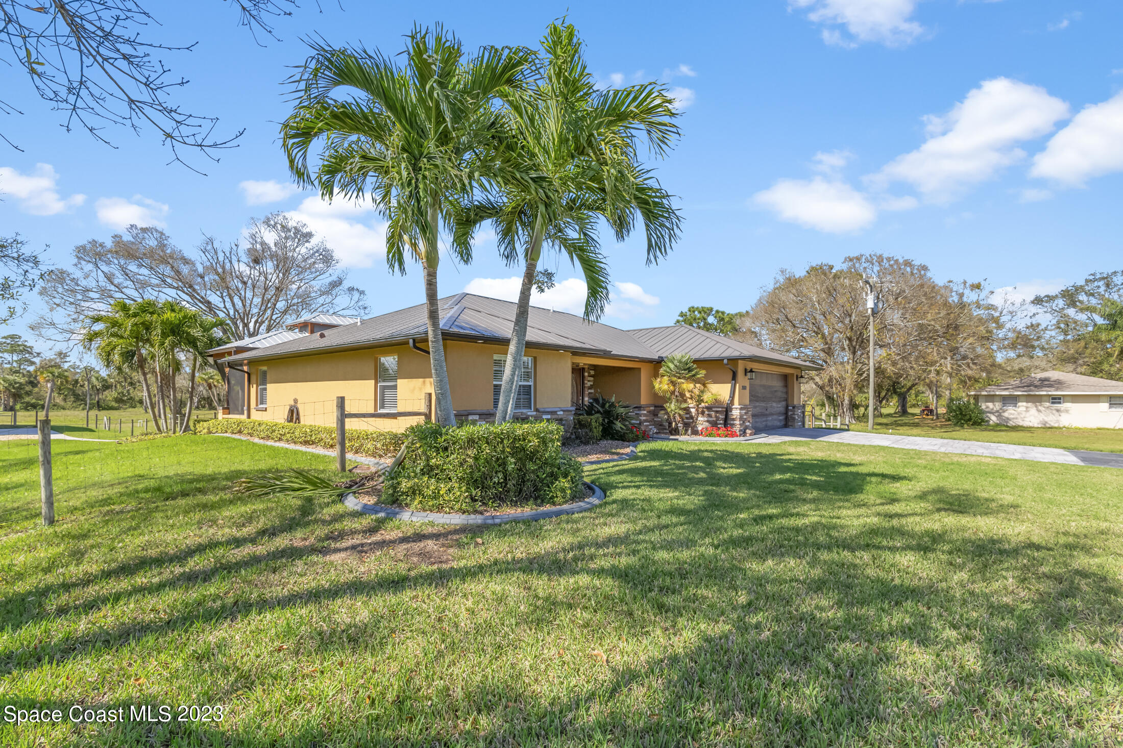 2660 Corey Road Malabar, FL 32950 - Photo 7 of 50 a front view of a house with a yard