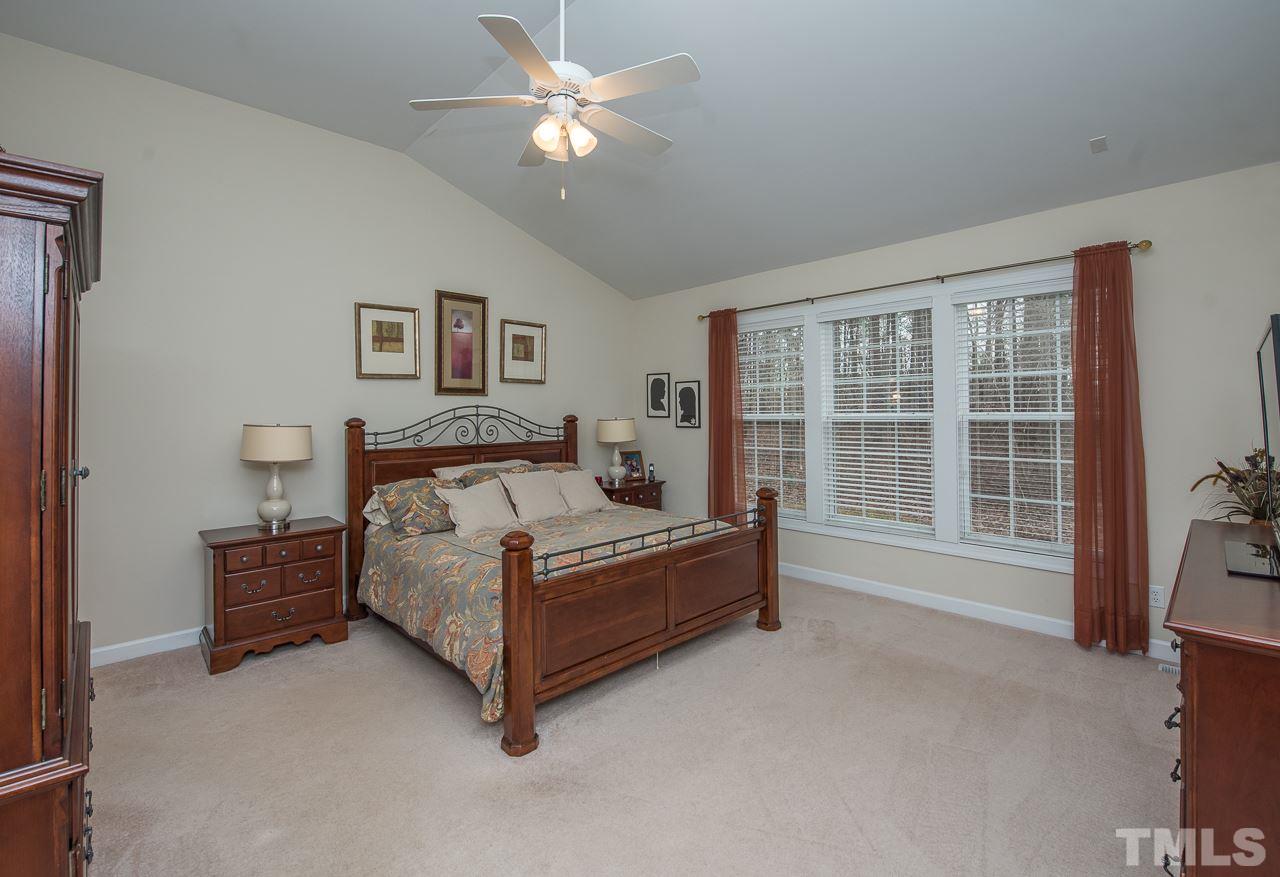 4424 Fairview Ridge Lane Apex, NC 27539 - Photo 12 of 25 Large Master bedroom overlooking the wooded yard