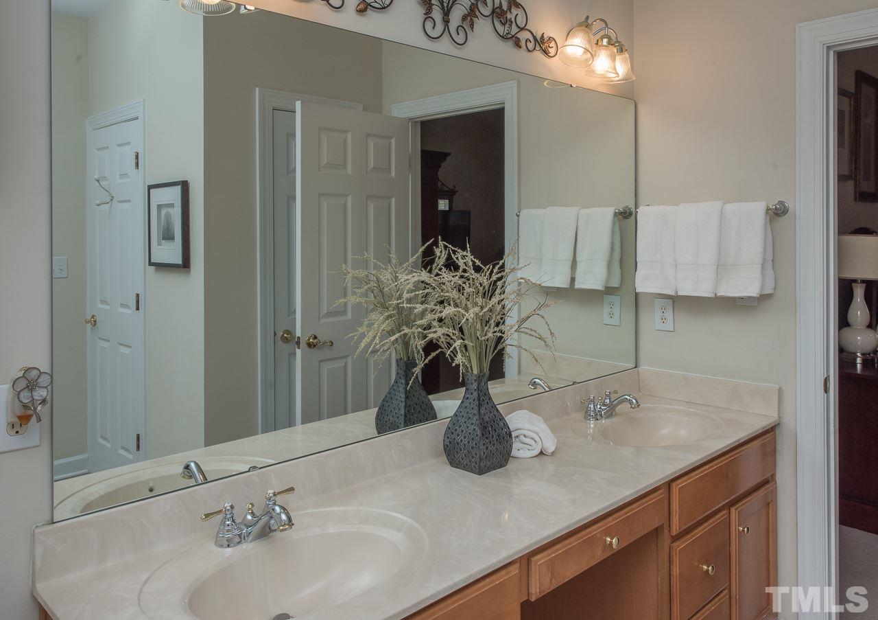 4424 Fairview Ridge Lane Apex, NC 27539 - Photo 13 of 25 Dual vanity, cabinets and large walk in closet