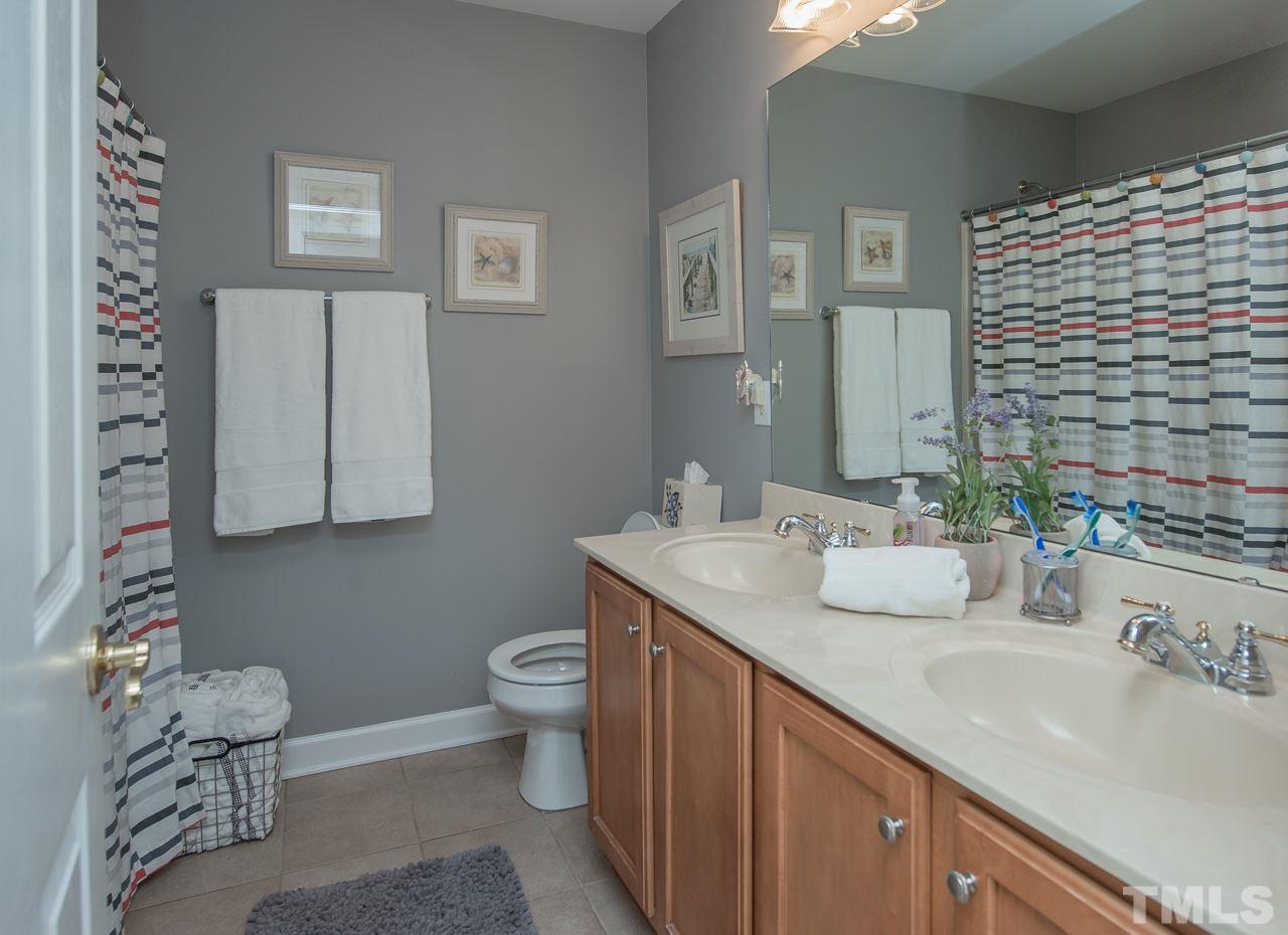 4424 Fairview Ridge Lane Apex, NC 27539 - Photo 20 of 25 Full bath on second floor with dual vanity and shower/tub combo