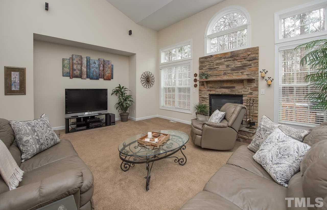 4424 Fairview Ridge Lane Apex, NC 27539 - Photo 10 of 25 Spacious family room with soaring ceiling and fireplace