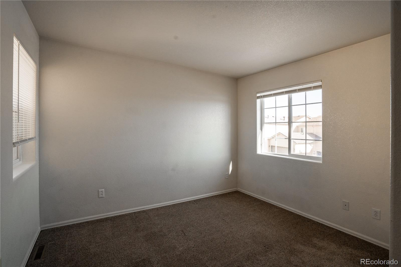 672 Bosque Vista Point, Unit 26 Colorado Springs, CO 80916 - Photo 18 of 25 an empty room with a window