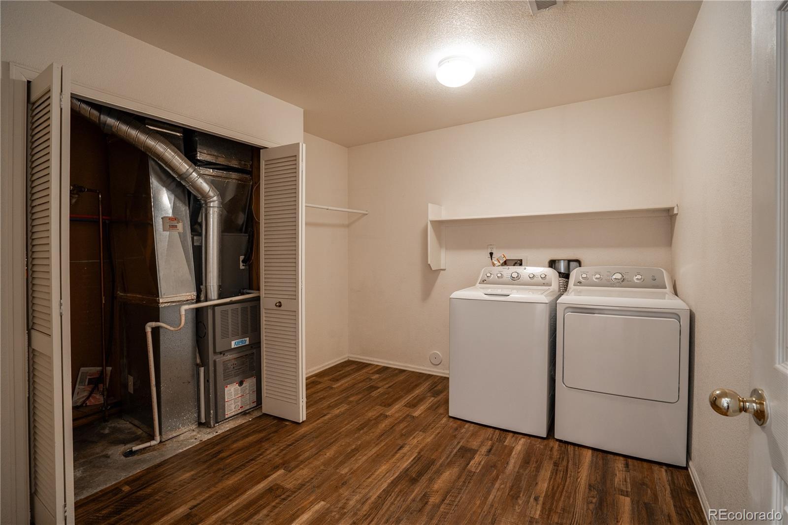 672 Bosque Vista Point, Unit 26 Colorado Springs, CO 80916 - Photo 19 of 25 a utility room with dryer and washer