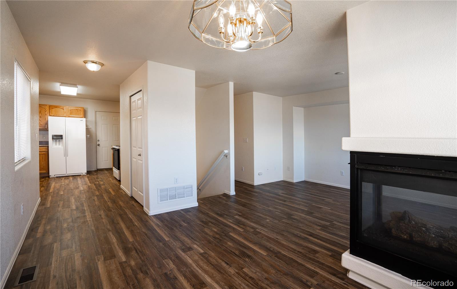 672 Bosque Vista Point, Unit 26 Colorado Springs, CO 80916 - Photo 9 of 25 a view of empty room with wooden floor