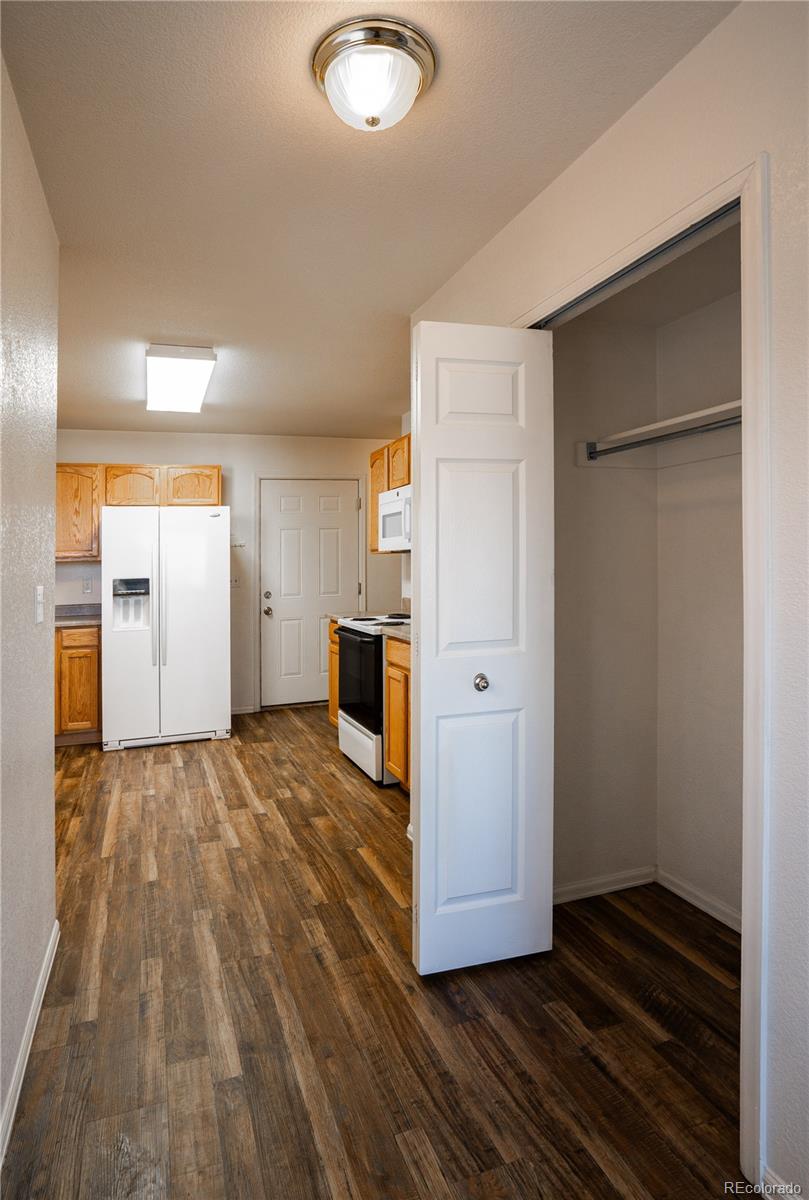 672 Bosque Vista Point, Unit 26 Colorado Springs, CO 80916 - Photo 10 of 25 a view of kitchen with refrigerator and window