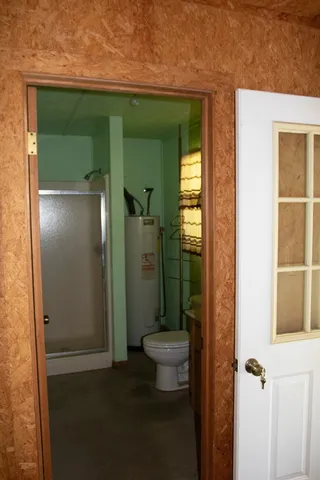 a view of hallway with furniture and large windows