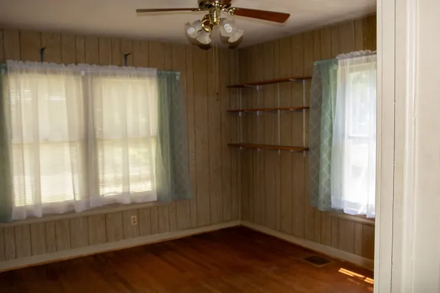 a view of an empty room with a window
