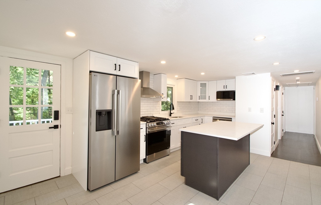 7 Barbara Road Kingston, MA 02364 - Photo 3 of 26 a kitchen with stainless steel appliances a refrigerator sink and stove