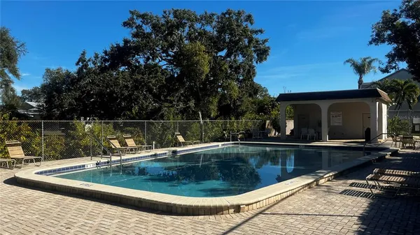 a view of a swimming pool with a patio