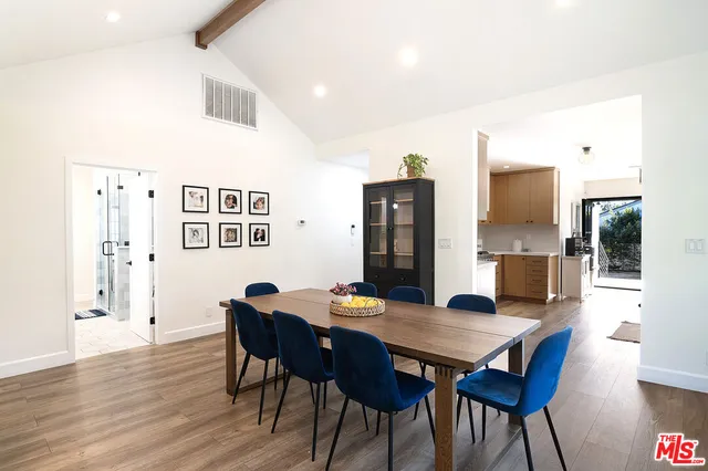 a kitchen with a counter top space a sink and stainless steel appliances